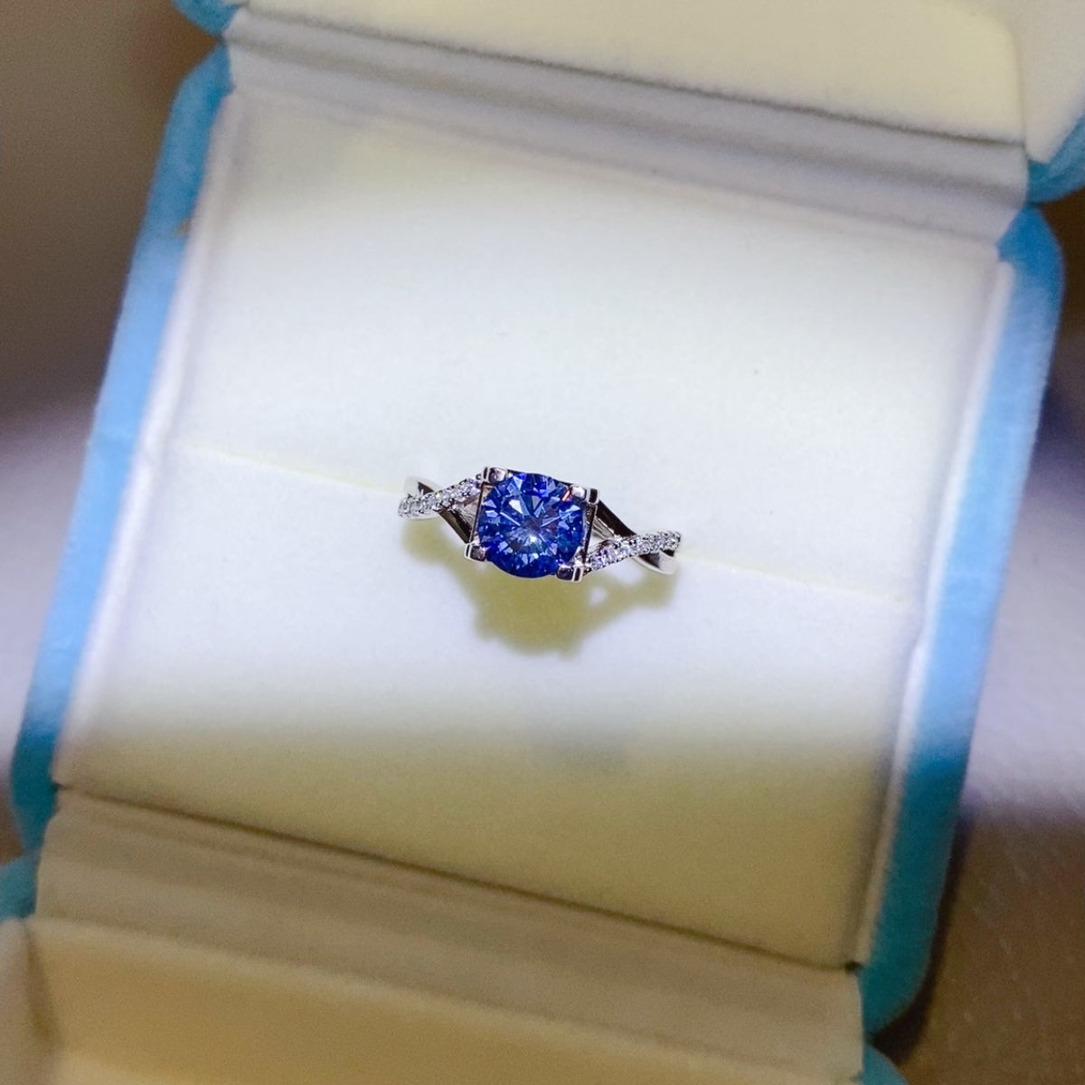 1 Carat Blue Brilliant Round Cut Sparkala™ Crisscross Pure Sterling Silver Ring