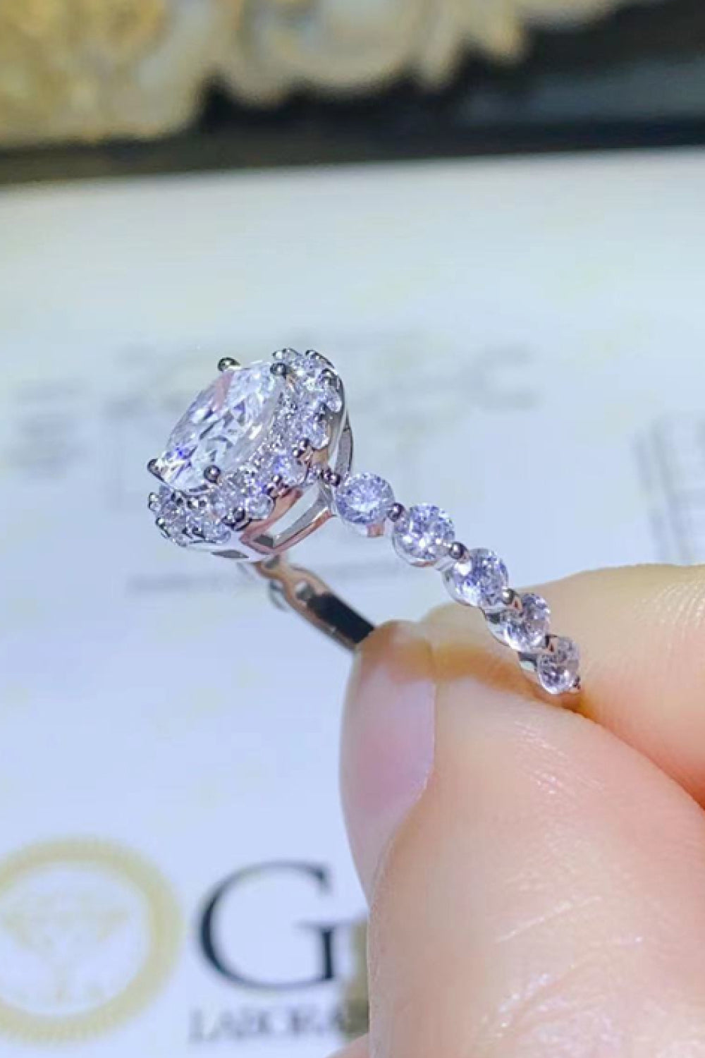 Adored 1 Carat Oval-Cut Sparkala™ Platinum Over Pure Sterling Silver Halo Ring