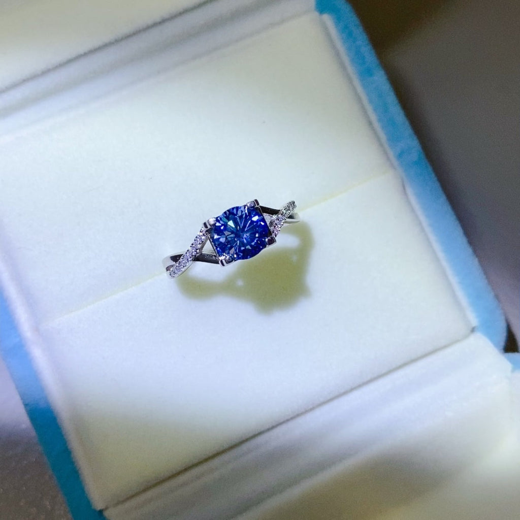 1 Carat Blue Brilliant Round Cut Sparkala™ Crisscross Pure Sterling Silver Ring
