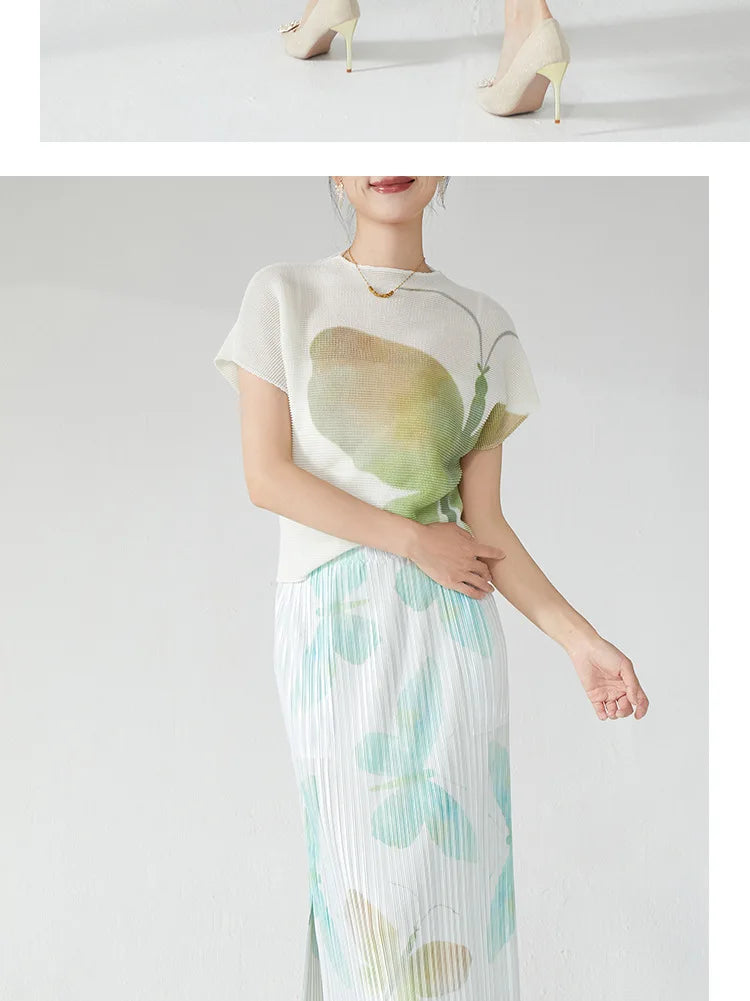 Summer women's outfit: a stylish two-piece set including a short-sleeved T-shirt and a pleated midi skirt with a slit.