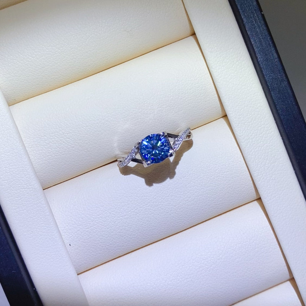 1 Carat Blue Brilliant Round Cut Sparkala™ Crisscross Pure Sterling Silver Ring