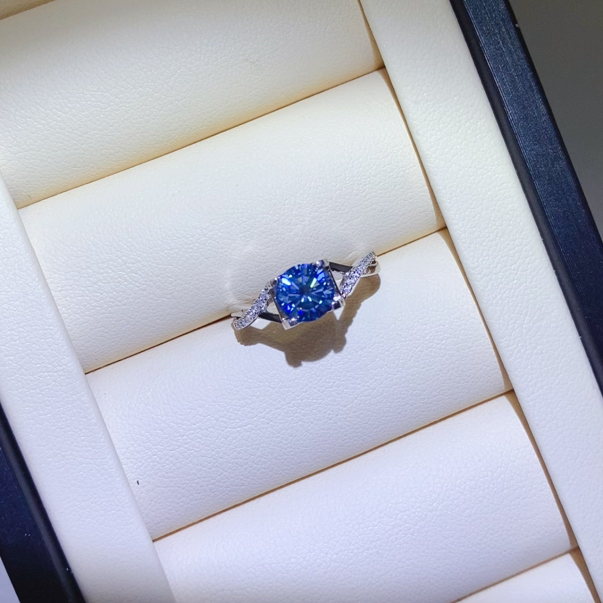 1 Carat Blue Brilliant Round Cut Sparkala™ Crisscross Pure Sterling Silver Ring